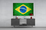 Flag of Brasil glass wall art catching light to reveal its painted stone-grunge