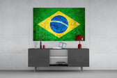 Flag of Brasil glass wall art catching light to reveal its painted stone-grunge