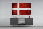 Flag of Denmark glass wall art catching light to reveal its painted scratched-metal grunge