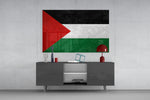 Flag of Palestine glass wall art catching light to reveal its painted edge