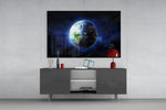 Earth glass wall art catching light to reveal its painted cobalt oceans