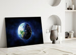 Close-up detail of Blue-Marble Earth and starfield behind glass