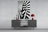 Censored glass wall art catching light to reveal its painted spiral