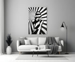 Close-up detail of zebra-stripe shadow and sunburst behind glass