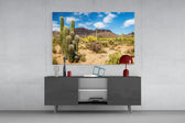 Cactuses glass wall art catching light to reveal its painted desert tones