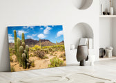 Close-up detail of Saguaro spines and prickly-pear pads behind glass