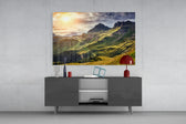 Mountain View glass wall art catching light to reveal its painted golden ridges