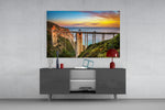 Bixby Creek Bridge glass wall art catching light to reveal its painted sunset tones