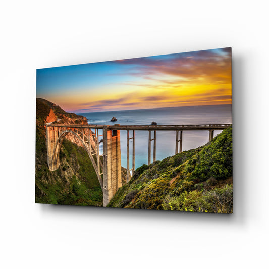 Bixby Creek Bridge glass wall art in a modern living room
