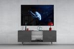 Jellyfish glass wall art catching light to reveal its painted cobalt glow