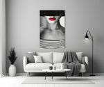 Close-up detail of crimson lips and Breton stripes behind glass