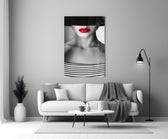 Close-up detail of crimson lips and Breton stripes behind glass