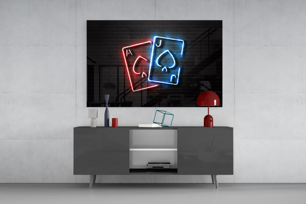 Ace and Joker glass wall art catching light to reveal its painted neon-tubes