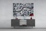Forest Landscape glass wall art catching light to reveal its painted snow tones