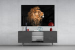 Lion glass wall art catching light to reveal its painted amber mane