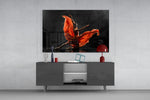 Ballet glass wall art catching light to reveal its painted scarlet silk