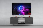 Abstract Art glass wall art catching light to reveal its painted neon circle