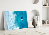 Close-up detail of sailboat and turquoise water behind glass