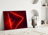 Close-up detail of scarlet neon-tube triangles behind glass