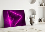 Close-up detail of magenta neon-tube triangles behind glass