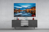 Helsinki Finland glass wall art catching light to reveal its painted blue-hour tones