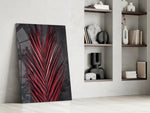 Botanical dikey panel against a charcoal-painted accent wall