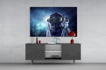 Astronaut In Space glass wall art catching light to reveal its painted gold visor