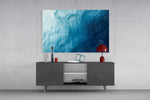 Shades Of Blue glass wall art catching light to reveal its painted blue washes