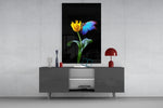 Abstract Art glass wall art catching light to reveal its painted tulip and morpho