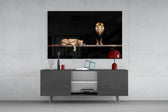 Leo Family glass wall art catching light to reveal its painted lion family