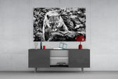 Puma glass wall art catching light to reveal its painted monochrome stalk