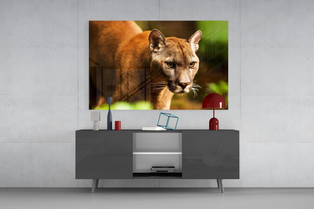 Puma glass wall art catching light to reveal its painted honey-tan coat