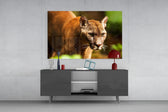 Puma glass wall art catching light to reveal its painted honey-tan coat