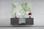 Botanical-poster cinematic glass wall art in Scandi-modern living room
