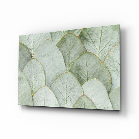 Sage eucalyptus leaves botanical cinematic glass wall art over walnut console in designer bedroom