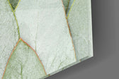 Sage-and-copper leaf cinematic glass wall art over modern dining sideboard