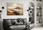 Sepia-amber mountain cinematic glass wall art in hospitality lounge