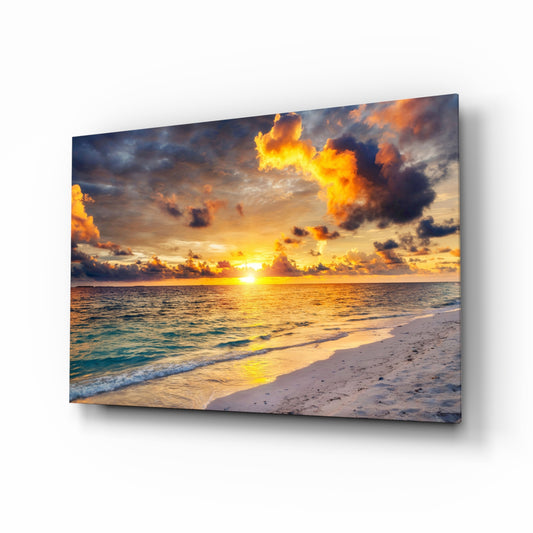 Maldives sunset beach cinematic glass wall art above linen sofa in coastal living room