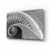 Spiral staircase concrete cinematic glass wall art above leather chair in designer office