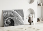 Brutalist concrete-stair cinematic glass wall art in modernist living room