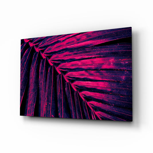 Magenta palm frond cinematic glass wall art above black media console