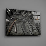 Straight razor and clipper glass wall art over walnut console in man-cave dressing room