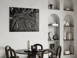 Slate-and-steel grooming cinematic glass wall art over master-bedroom dresser
