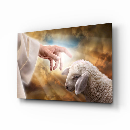 Good Shepherd hand and lamb cinematic glass wall art above Christian home library reading chair