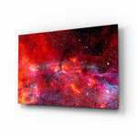 Crimson galaxy nebula cinematic glass wall art above leather sofa in study
