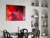 Magenta-and-cyan galaxy cinematic glass wall art over master-bedroom headboard