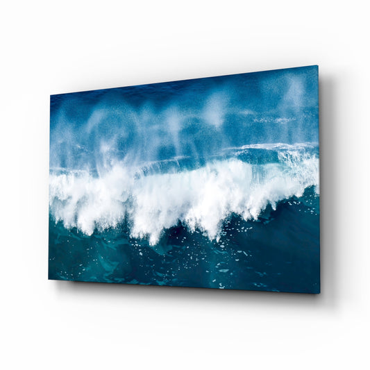 Breaking wave cobalt cinematic glass wall art above linen sofa in coastal living room
