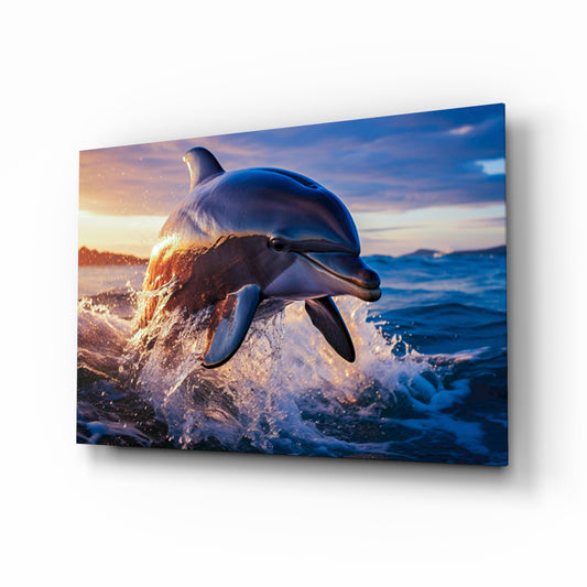 Leaping dolphin sunset cinematic glass wall art above linen sofa in coastal living room
