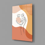 Matisse-style cheek-and-hand cinematic glass wall art in wellness studio reception