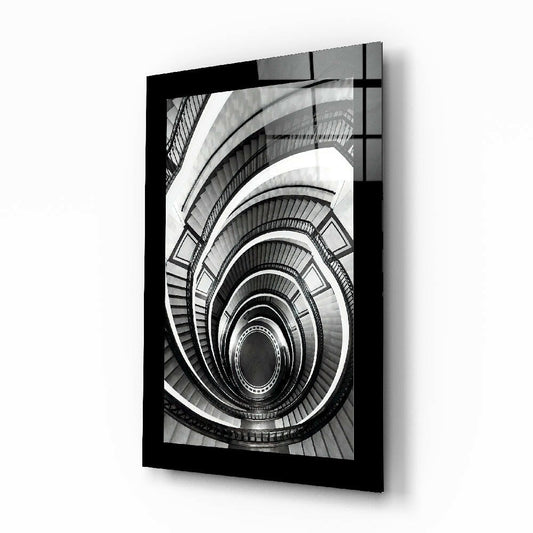 Spiral Stairs glass wall art displayed above a console in an entryway